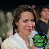 Woman with shoulder-length brown hair with the Oxford Weekly Planet logo in the bottom right corner