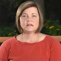 Woman with brown hair with blonde highlights