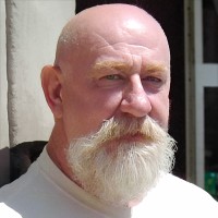 Older bald man with white beard and mustache