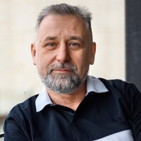 Man with salt and pepper hair and goatee