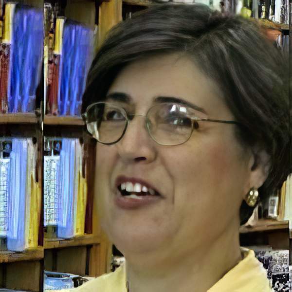 Woman with glasses and short dark hair