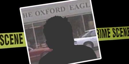 Silhouette of a man with the newspaper office behind him and crime scene tape in the background