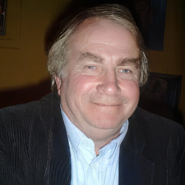 Smiling man with thinning light-colored hair