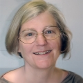 Woman with glasses and a short blonde bob haircut