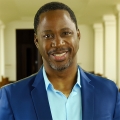 Smiling man with dark, close-cropped hair and graying goatee