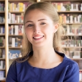 Smiling young woman with long, light brown hair