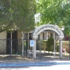 Front entrance to Yoknapatawpha Acres nursing home with the Oxford Weekly Planet logo in the foreground