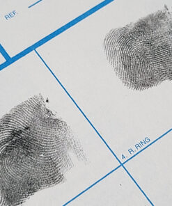Inked fingerprints on a white fd-258 applicant card